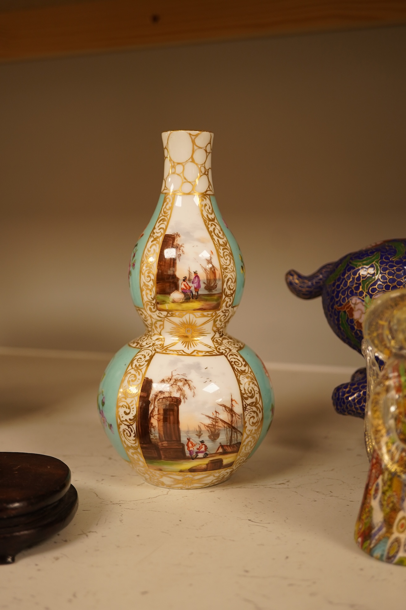 A Chinese cloisonné enamel horse and vase, two miniature Rockingham floral teapots, a malachite box etc (9). Cloisonné horse 20cm long.